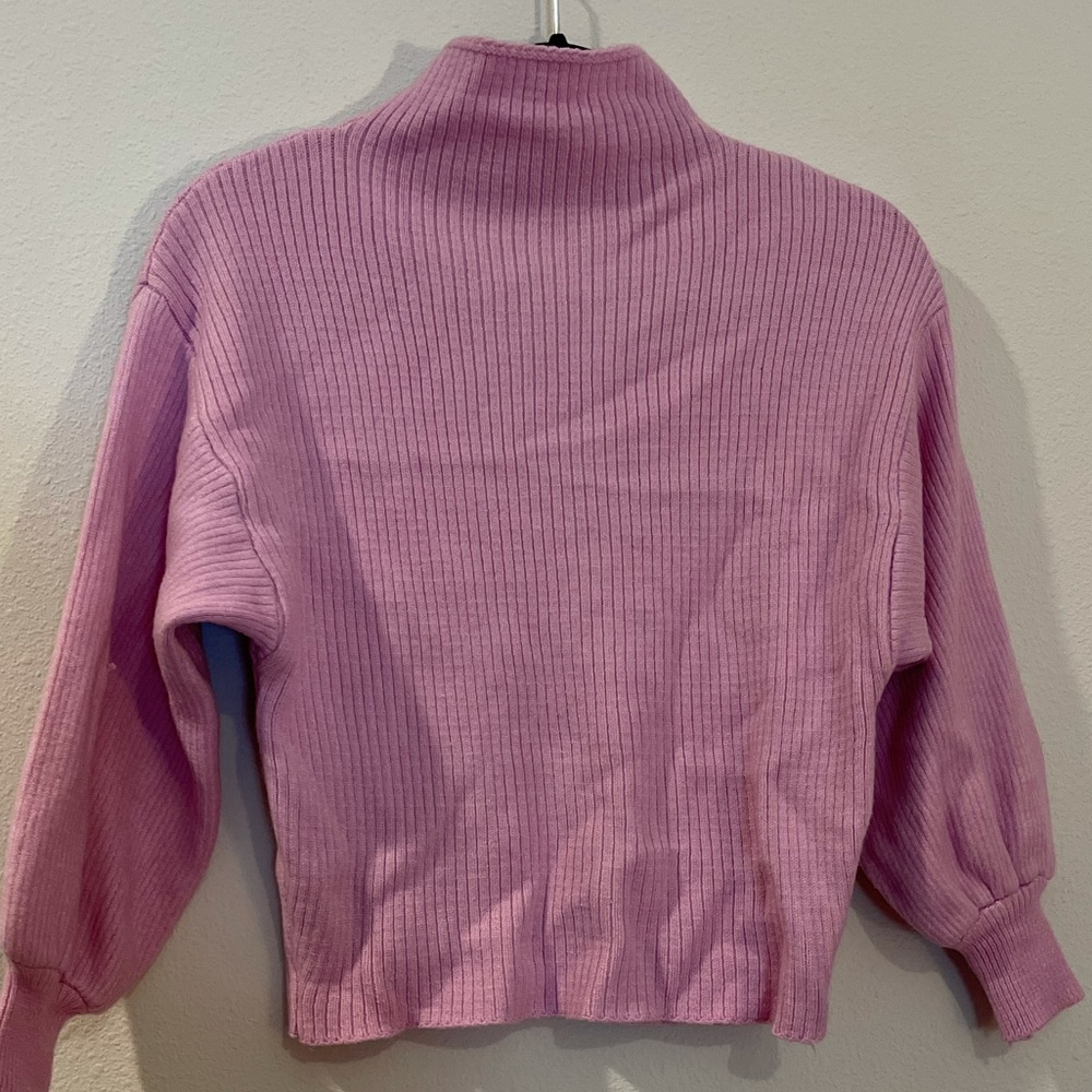 Pink knit turtleneck sweater